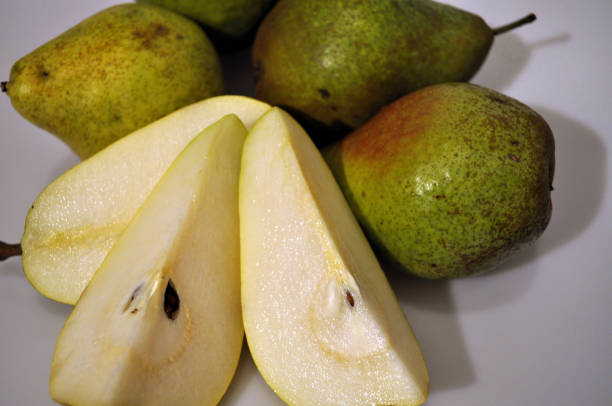 istock Fresh ripe pear on a white background. Large green pear 1178151812