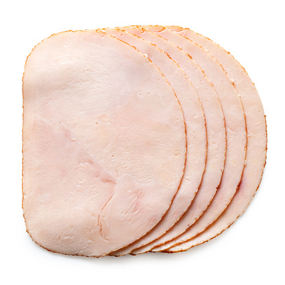 A stack of five slices of chicken ham isolated on white. Top view.