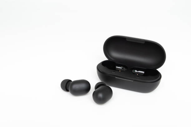istock Black true wireless earbuds with power bank case on the white isolated background 1178152067