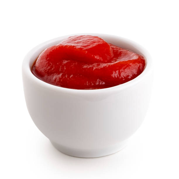 istock Tomato ketchup in small white ceramic dish isolated on white. 1178152287