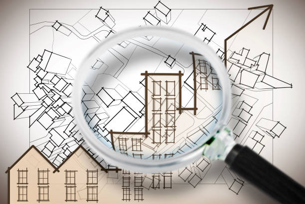 istock Studying the real estate market - concept image with a chart seen through a magnifying glass 1178159181