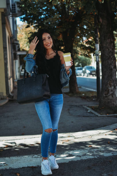 istock Woman drinking coffee in the city 1178160816