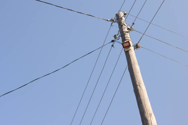 electric wood pole on the blur sky background
