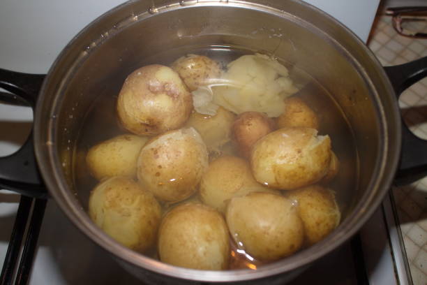 istock potatoes cooked in a pan on the stove 1178161254