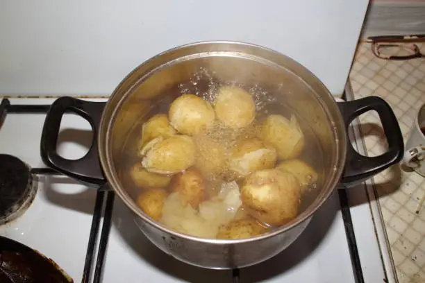 Photo of potatoes cooked in a pan on the stove