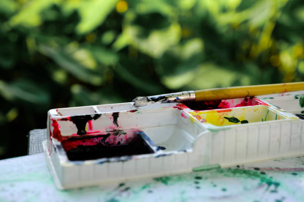 istock Paintbrush and watercolor paint tray, artwork and ideas 1178161406