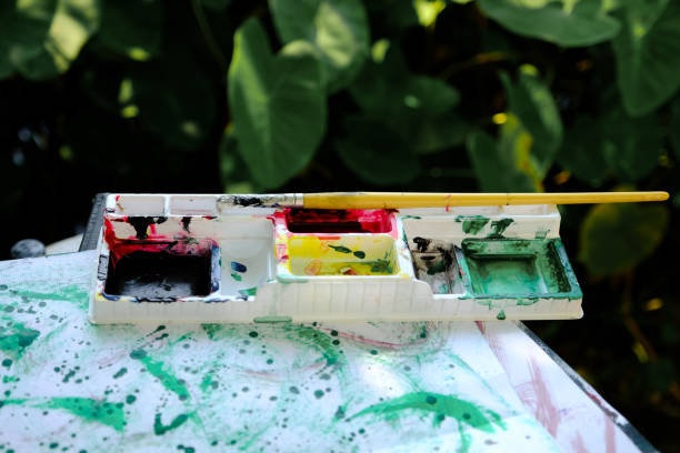 istock Paintbrush and watercolor paint tray, artwork and ideas 1178161433
