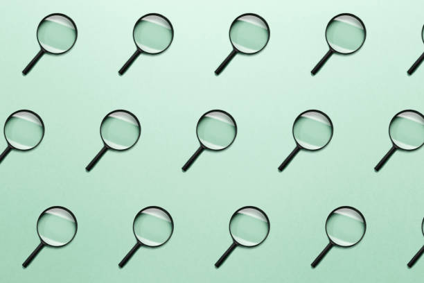 istock Trendy pattern made with Magnifying glass on bright light mint background. Concept information search. Minimal style with colorful paper backdrop. Colorful photo. Minimal creative concept. Neo mint 1178162587