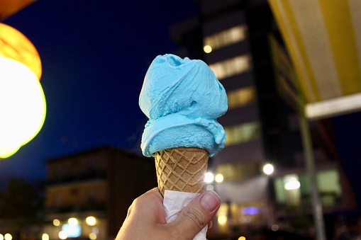 Blue ice cream, mint ice cream, summer, kid eating ice cream, hungry, sweets, cold, dessert, eating outdoors, snack, eating ice cream, people eating ice cream, eating outside, bright colors, minimalism, minimalist, hands, gift, mint color, night, one object, in the hand, background, delicious
