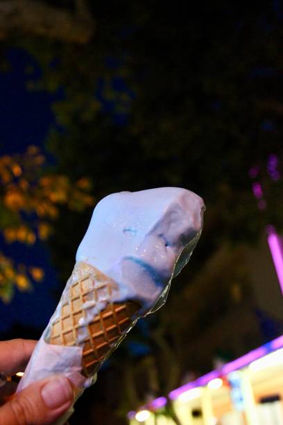 istock Blue mint ice cream in hand. Blue ice cream in a waffle cone 1178163216
