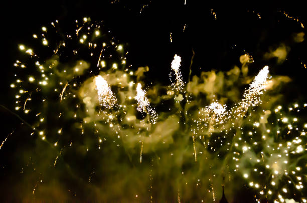 powerful, coloured explosions at a celebration at night, very sparkliong and beautiful, reality