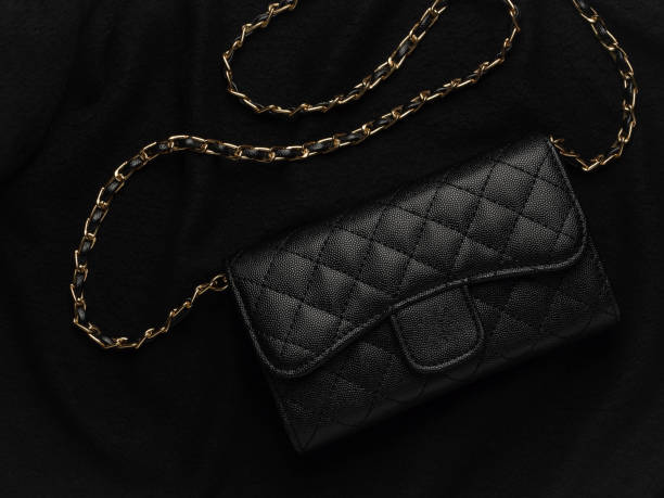 Black leather bag with golden chain
