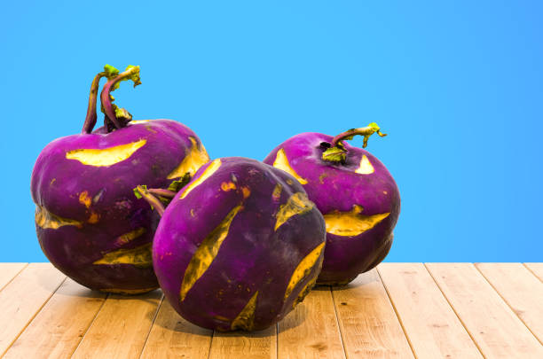 Ripe purple kohlrabi, freshly harvested from an organic farm, placed on a black background, is a healthy ingredient for cooking