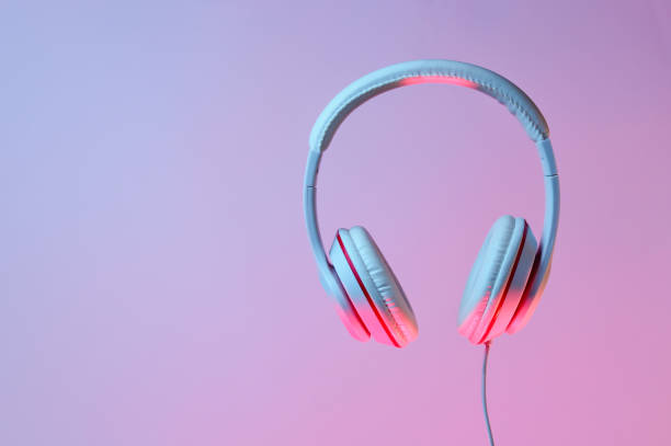 istock Classic wired headphones with gradient blue pink neon light. Retro style.Retro wave. 80s. Minimalistic music concept. 1178171308