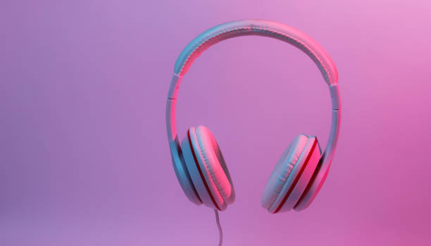 istock Classic wired headphones with gradient blue pink neon light. Retro style.Retro wave. 80s. Minimalistic music concept. 1178171339