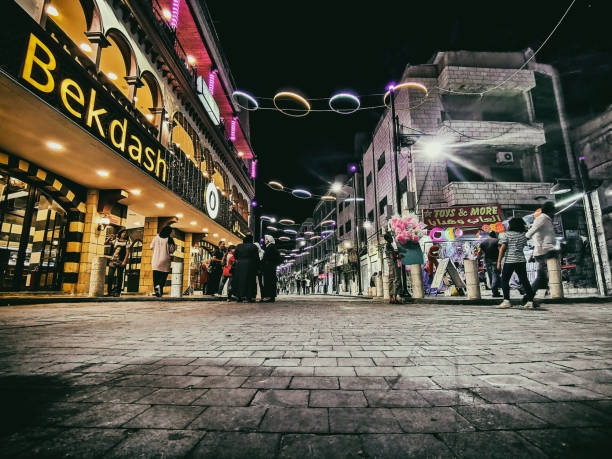 Night scene at Downtown, Amman, Jordan. Walking aisle is shown. Beckdash is an ice scream famous shop. Street lights exist. Dark sky is at background.