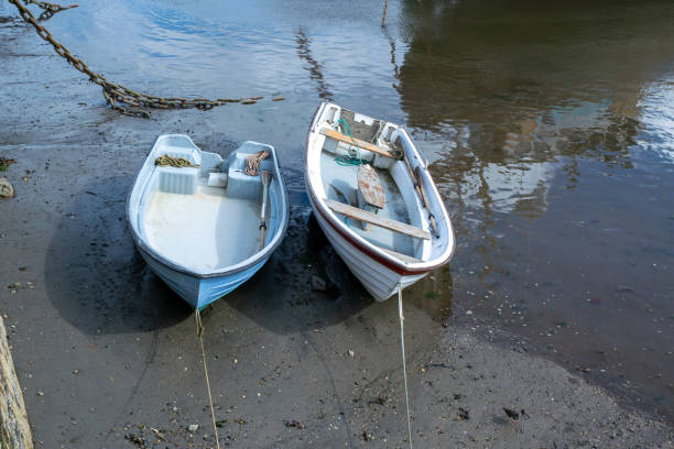 istock Two small tender boats moored by a slipway 1178171490