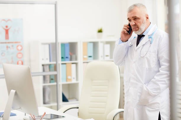 istock Doctor talking on the phone 1178172613
