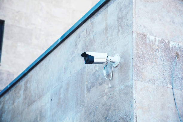istock video camera in the street wall 1178172792
