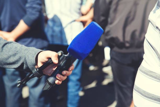 istock man hand speaker in nature 1178172878