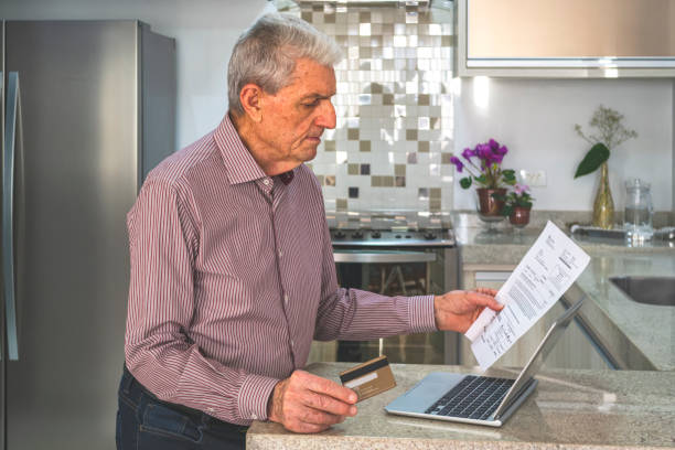 istock Senior man at home using a laptop. 1178175378