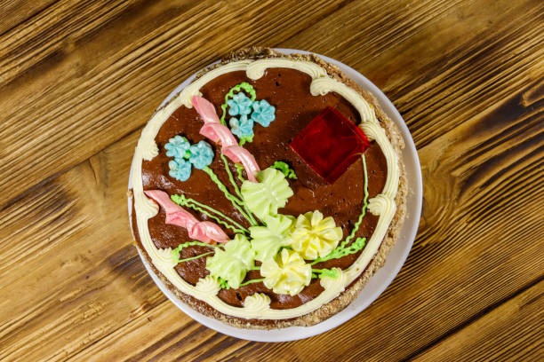 istock Kiev cake with cream, nuts and meringue on wooden table. Top view 1178175628