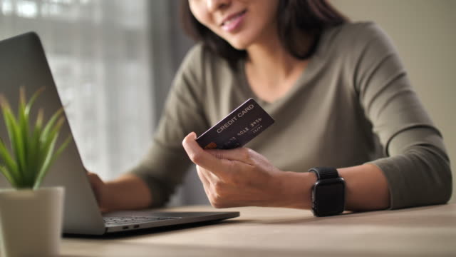 Young woman Using credit card payment