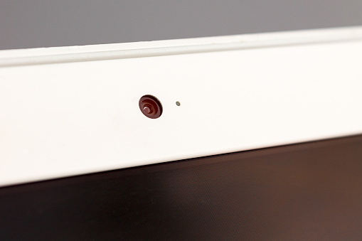 built-in laptop webcam close-up, the concept of facial recognition, unlocking, personal data protection