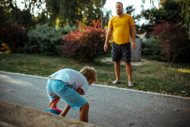 istock Father and son playing outdoors 1178180433
