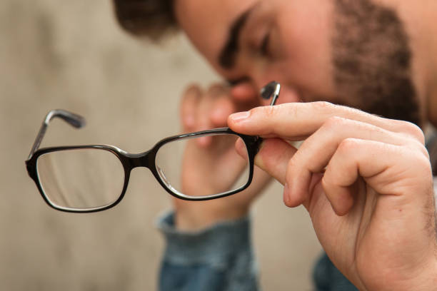 man with tired eyes after long work - human eye tired rubbing businessman imagens e fotografias de stock