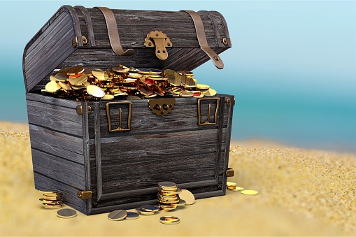 A photo of a pirates chest full of loot on a white background.