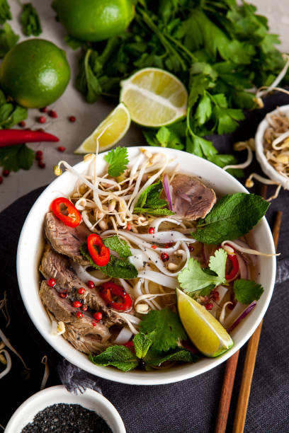 istock Pho Noodle Soup on dark table. Beef with Chilli, Basil, Rice Noodles, Bean Shoots showing noodles 1178188231