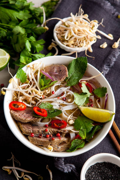 istock Pho Noodle Soup on dark table. Beef with Chilli, Basil, Rice Noodles, Bean Shoots showing noodles 1178188364