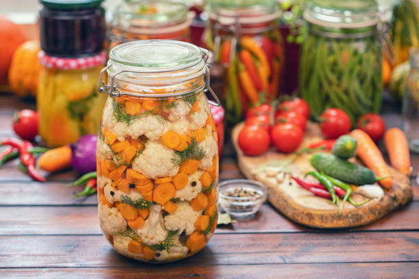 istock Preserving Cauliflower, Carrots and Garlic in Jars 1178188406
