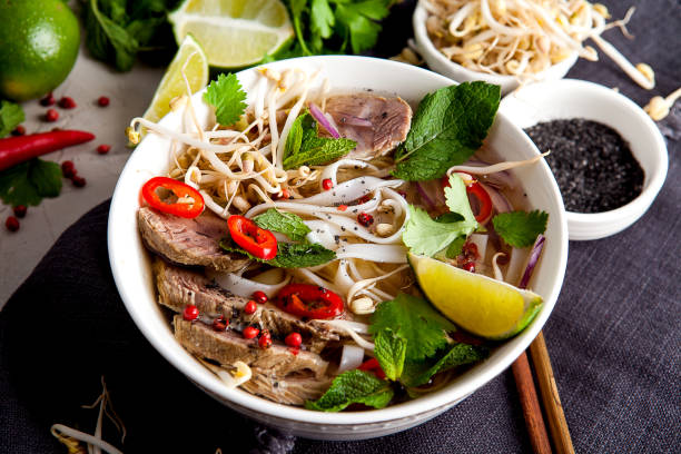 istock Pho Noodle Soup on dark table. Beef with Chilli, Basil, Rice Noodles, Bean Shoots showing noodles 1178188433