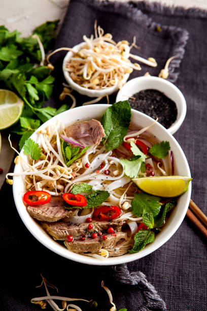 istock Pho Noodle Soup on dark table. Beef with Chilli, Basil, Rice Noodles, Bean Shoots showing noodles 1178188522