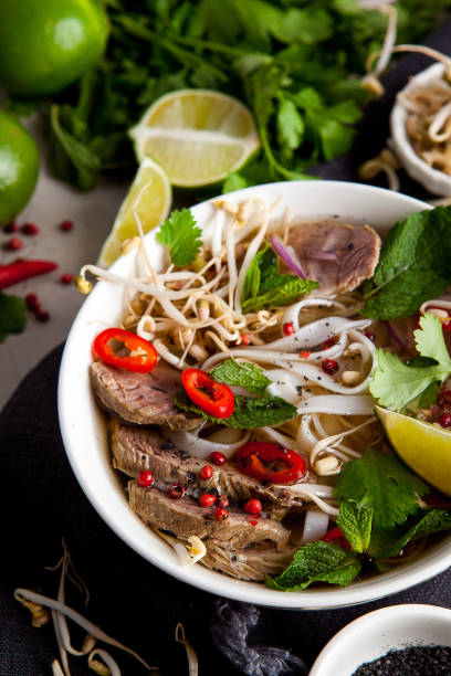 istock Pho Noodle Soup on dark table. Beef with Chilli, Basil, Rice Noodles, Bean Shoots showing noodles 1178188613