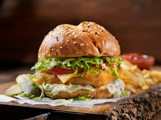 istock Crispy Fish Burger with Tarter Sauce, Lettuce, Tomato on a Brioche Bun 1178189309