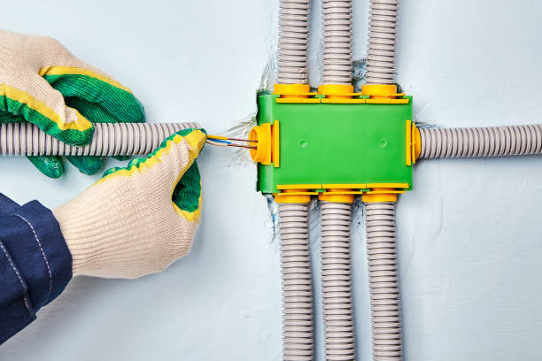 istock An electrician is wires in electrical junction box. 1178189865