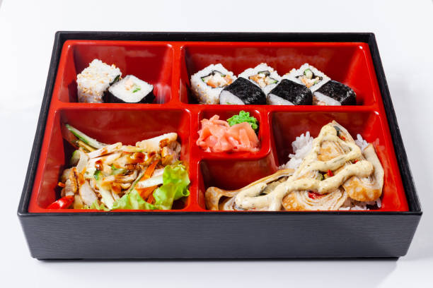 istock Fresh food portion in japanese bento box with salad, main course. Sushi roll with vegetables. Vegetarian dish. 1178190079
