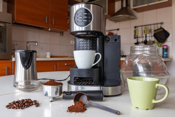 istock Making tasty coffee in the home kitchen. Coffee maker and accessories needed to prepare it. Dark background. 1178192939