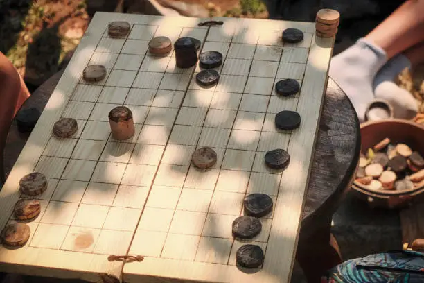 Photo of Old game popular in Rome, similar to checkers. Reconstruction of ancient roman board game latrunculorum, latrunculi, or latrones.