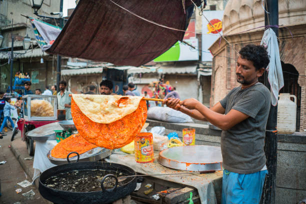 Lahore/Pakistan Lahore/Pakistan-August 13, 2019: man is cooking street food at the streets of Lahore, Pakistan lahore pakistan photos stock pictures, royalty-free photos & images