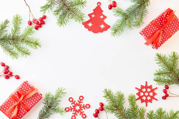 istock Flat lay frame with spruce branches, christmas decorations and gift box on a white background 1178196021