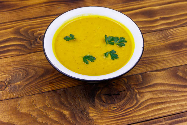 istock Pumpkin soup on a wooden table 1178198731