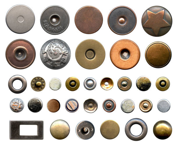 Set of different metal buttons and rivets. Vintage fushion accessories close-up isolated on a white background. Denim culcure modern style Set of different metal buttons and rivets. Vintage fushion accessories close-up isolated on a white background. Denim culcure modern style. Trousers and jackets elements isolated on white background rivet stock pictures, royalty-free photos & images