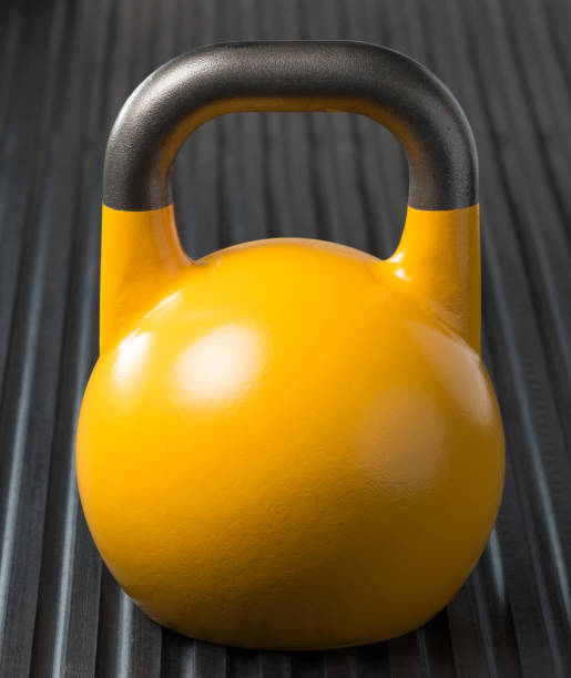 istock Yellow weight training kettlebell on a gym mat 1178204347