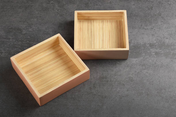 istock Wooden boxes or trays on the gray texture with copy space 1178205028