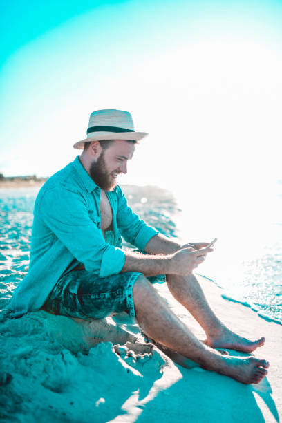 istock Male With Smartphone Enjoying Cuban Beach Sunset 1178207005