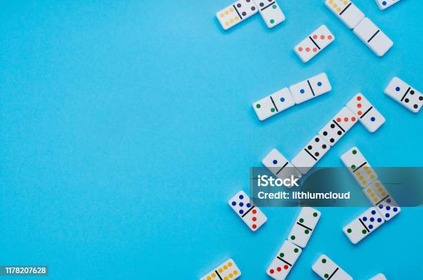 Dominoes On Blue Background With Copy Space Stock Photo - Download Image Now - Domino, Backgrounds, Number